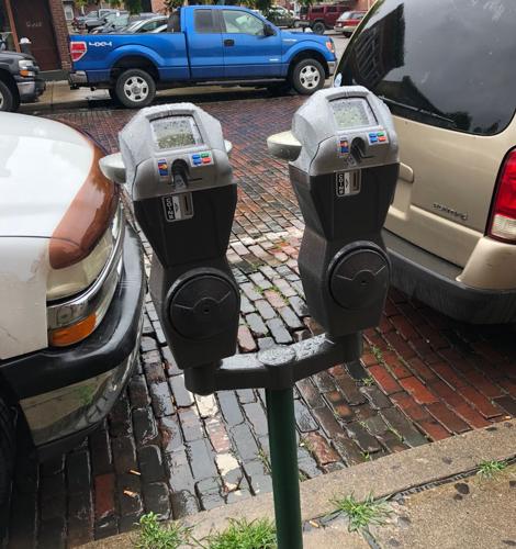 dual parking meters on city street